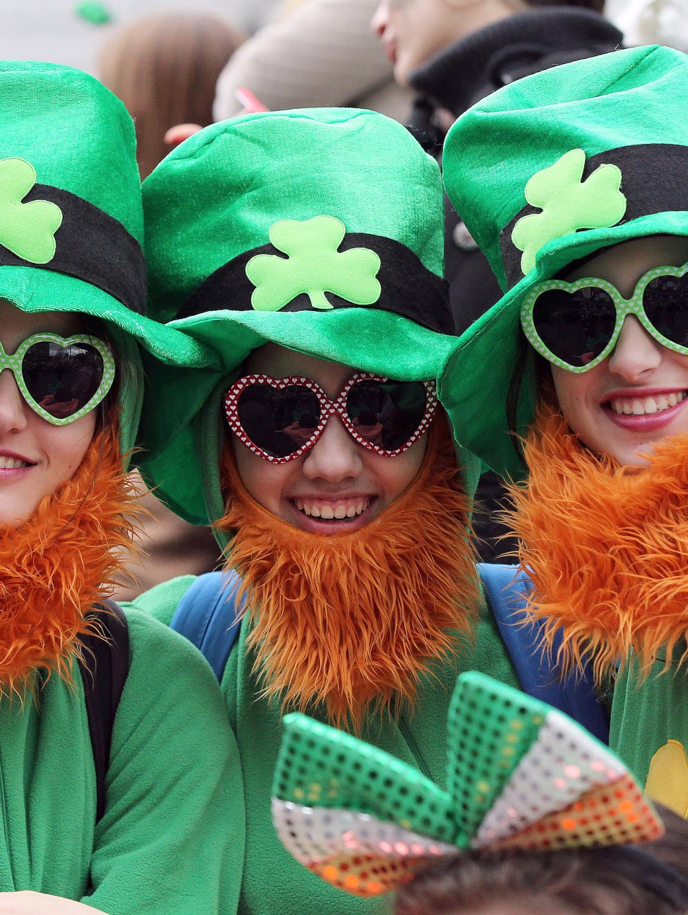 Spectators dressed as leprechauns attend St Patrick's Day parade in Dublin on March 17, 2014. More than 100 parades are being held across Ireland to mark St Patrick's Day, the feast day of the patron saint of Ireland, with up to 650,000 spectators expected to attend the parade in Dublin. AFP PHOTO/ PETER MUHLY        (Photo credit should read PETER MUHLY/AFP/Getty Images)